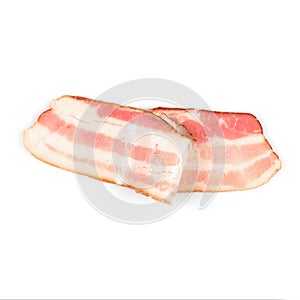 Rasher or smoked sliced bacon ready for cooking. One piece of pork belly isolated on white background, close-up