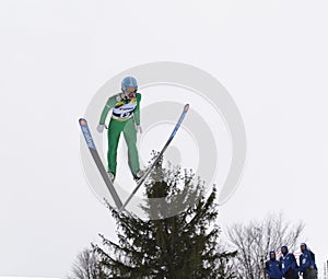 Rasnov, Romania - February 7: Unknown ski jumper competes in the FIS Ski Jumping World Cup Ladies on February 7, 2015 in Rasnov