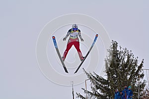 Rasnov, Romania - February 7: Unknown ski jumper competes in the FIS Ski Jumping World Cup Ladies on February 7, 2015 in Rasnov