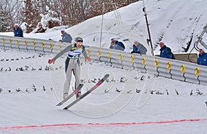 Rasnov, Romania - February 7: Unknown ski jumper competes in the FIS Ski Jumping World Cup Ladies on February 7, 2015 in Rasnov