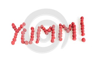 Raspberries forming the word Yumm