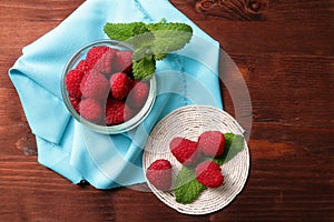 Raspberries in a glass container and on a string circle photo