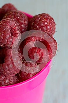 Raspberries in pink dish