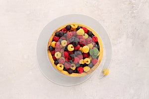 Raspberries of three colors are yellow, red and black, top view