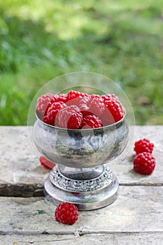 Raspberries in vintage silver goblet