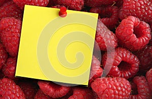 Raspberries and yellow note