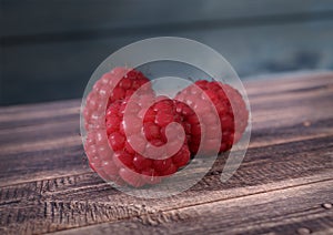Raspberrieson wooden desk. 3D render