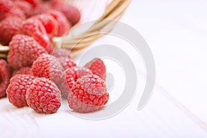 Raspberry in a basket on the table