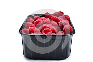 Raspberry in black container isolated on white background