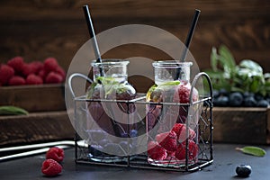 raspberry and blueberry berry lemonade in small bottles