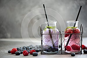 raspberry and blueberry berry lemonade in small bottles