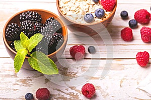 Raspberry, blueberry with mint and oatmeal breakfast or smoothie