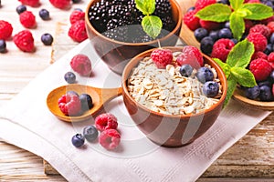 Raspberry, blueberry with mint and oatmeal breakfast or smoothie