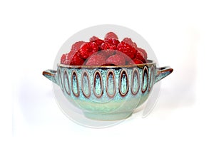 Raspberry in bowl, berries in clay plate, dessert in beautiful dish, red fruit in cup.