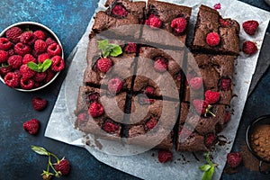 Raspberry brownies on blue background