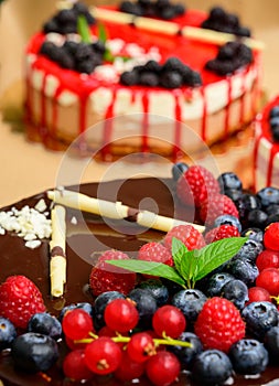 Raspberry cake and many fresh raspberries ,Forest wild berry fruits Muss cake with chocolate an white chocolate