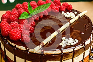 Raspberry cake and many fresh raspberries ,Forest wild berry fruits Muss cake with chocolate an white chocolate