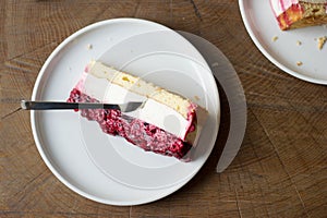 Raspberry cheesecake on a white plate