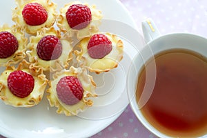 Raspberry dessert with a cup of tea