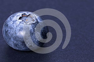 Raspberry drops on grey background