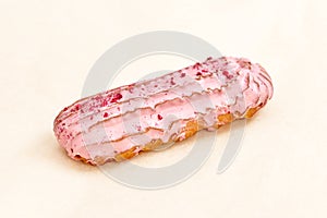 Raspberry Eclair cake, delicious pastries closeup on a light background