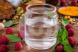 Raspberry extract is stirred in water