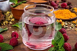 Raspberry extract is stirred in water