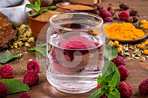 Raspberry extract is stirred in water