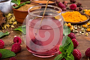 Raspberry extract is stirred in water