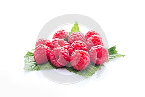 Raspberry fruit with leaf isolated on white