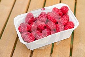 Raspberry fruits in a punnet