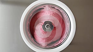 Raspberry Ice Cream Churning in Ice Cream Machine