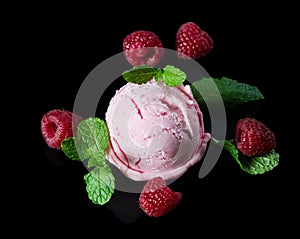 Raspberry ice cream with fresh berries and mint.