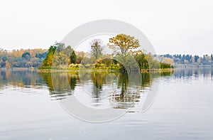 Raspberry island on lake Senezh in Solnechnogorsk fall in the fog in calm weather