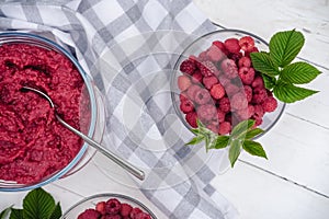 Raspberry jam making. berries and leaves