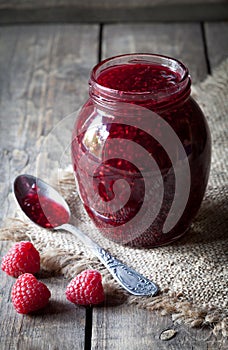 Raspberry jam sweet jelly preserve in mason jar