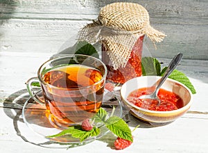 Raspberry jam and tea in cup