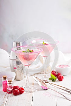 Raspberry martini on white table