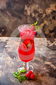 Raspberry and Mint Mojito with lemon slice served in cocktail glass isolated on dark background side view of healthy drink