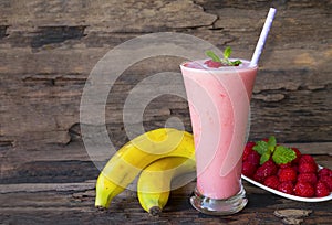 Raspberry mix banana smoothie red colorful fruit juice milkshake blend beverage.