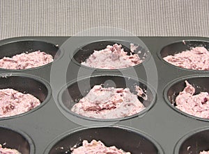 Raspberry muffins in a muffin cake pan