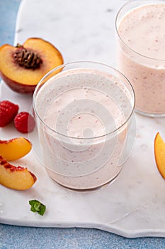 Raspberry peach smoothie, healthy and refreshing drink
