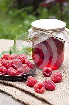 Raspberry preserve and fresh raspberries