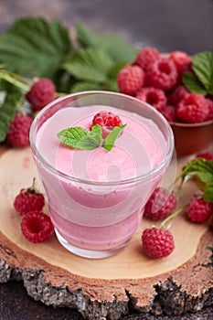 Raspberry smoothie in glass jar. Healthy refreshed homemade beverage.