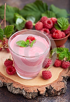 Raspberry smoothie in glass jar. Healthy refreshed homemade beverage.