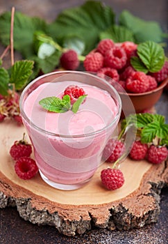 Raspberry smoothie in glass jar. Healthy refreshed homemade beverage. photo