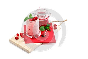 Raspberry smoothie and raspberry jam on a white background.