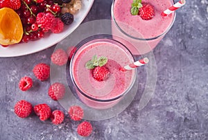Raspberry smothies and raspberry fruit on the cocreate background