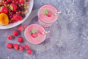 Raspberry smothies and raspberry fruit on the cocreate background
