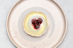 raspberry strawberry whipped creamy tartlets.confection dessert.pastry cheesecake with ripe berries